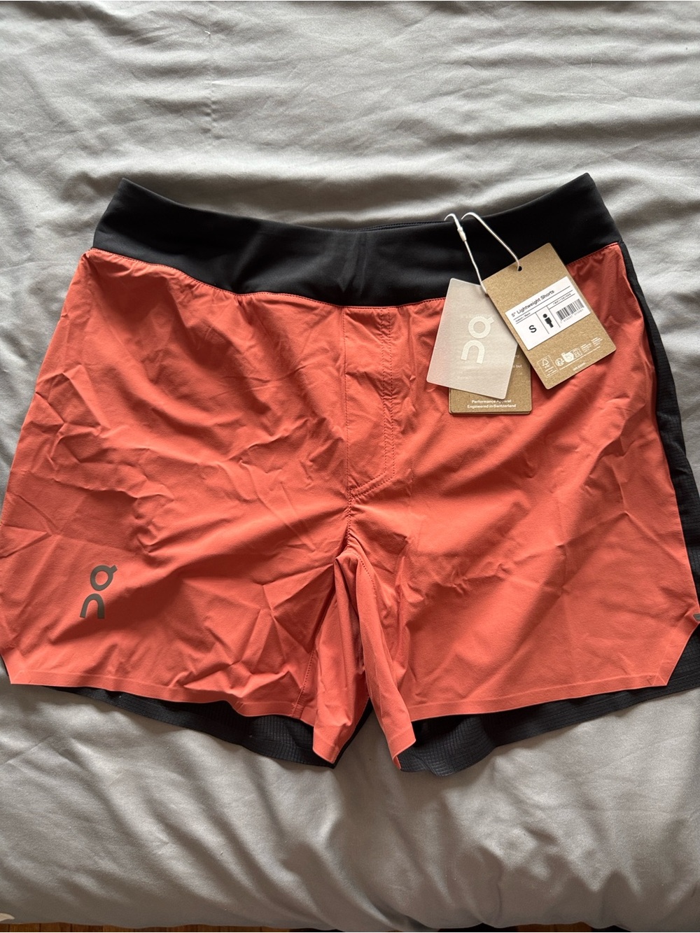 On Running Coral-Red Athletic Shorts with Black Waistband